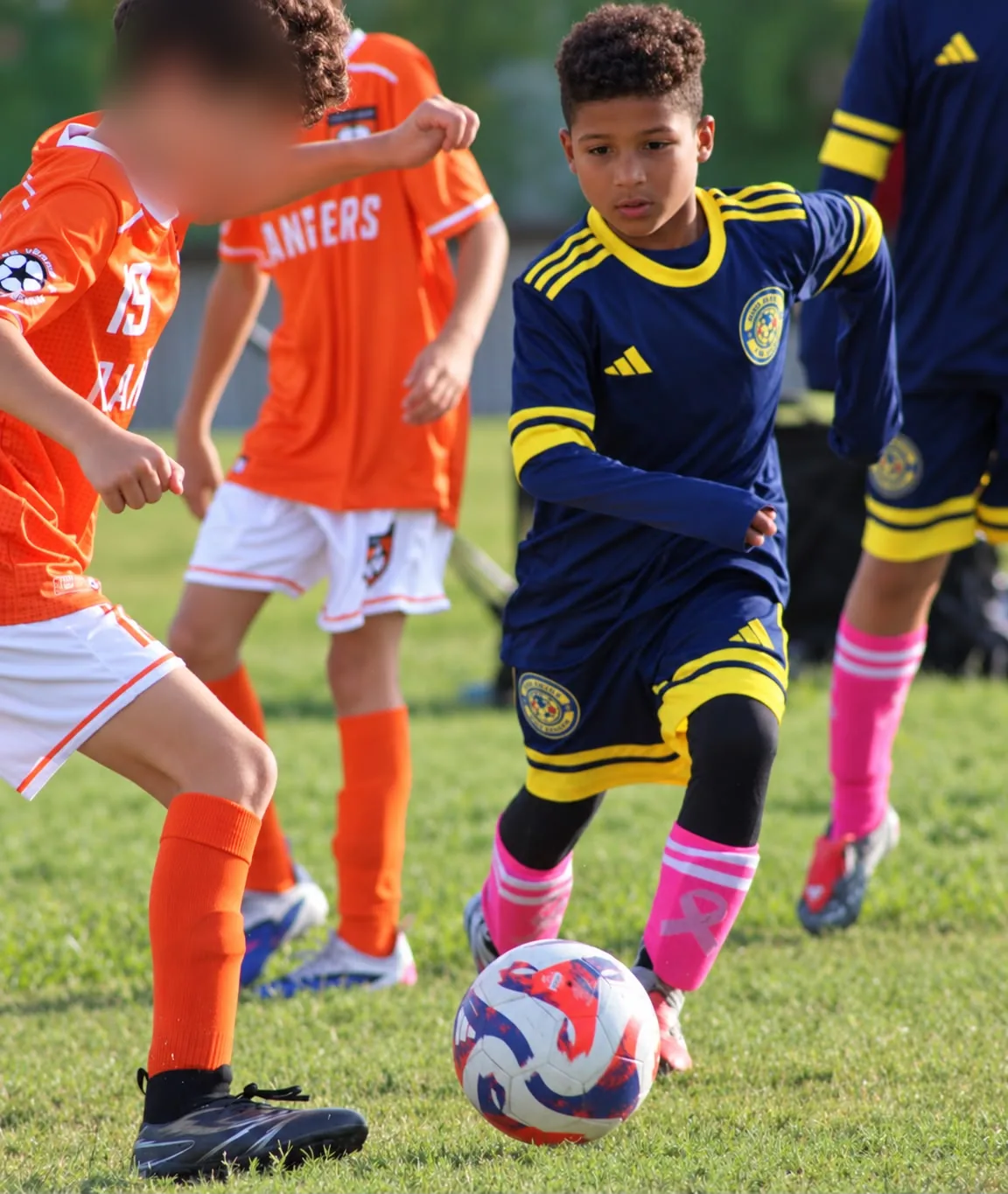 U11 player chasing the ball