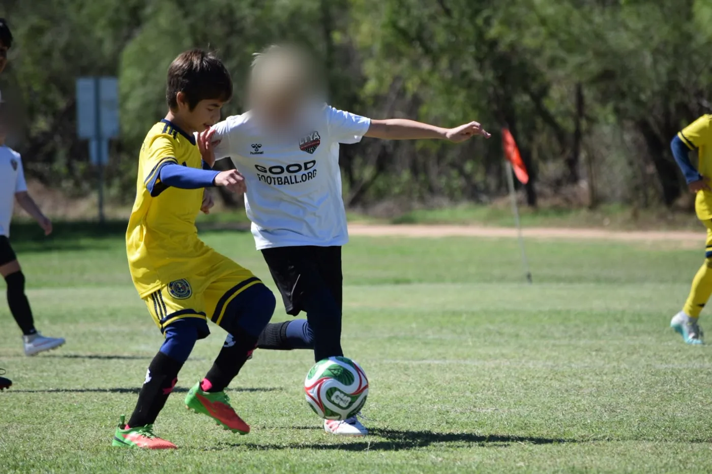 U11 player battling for the ball